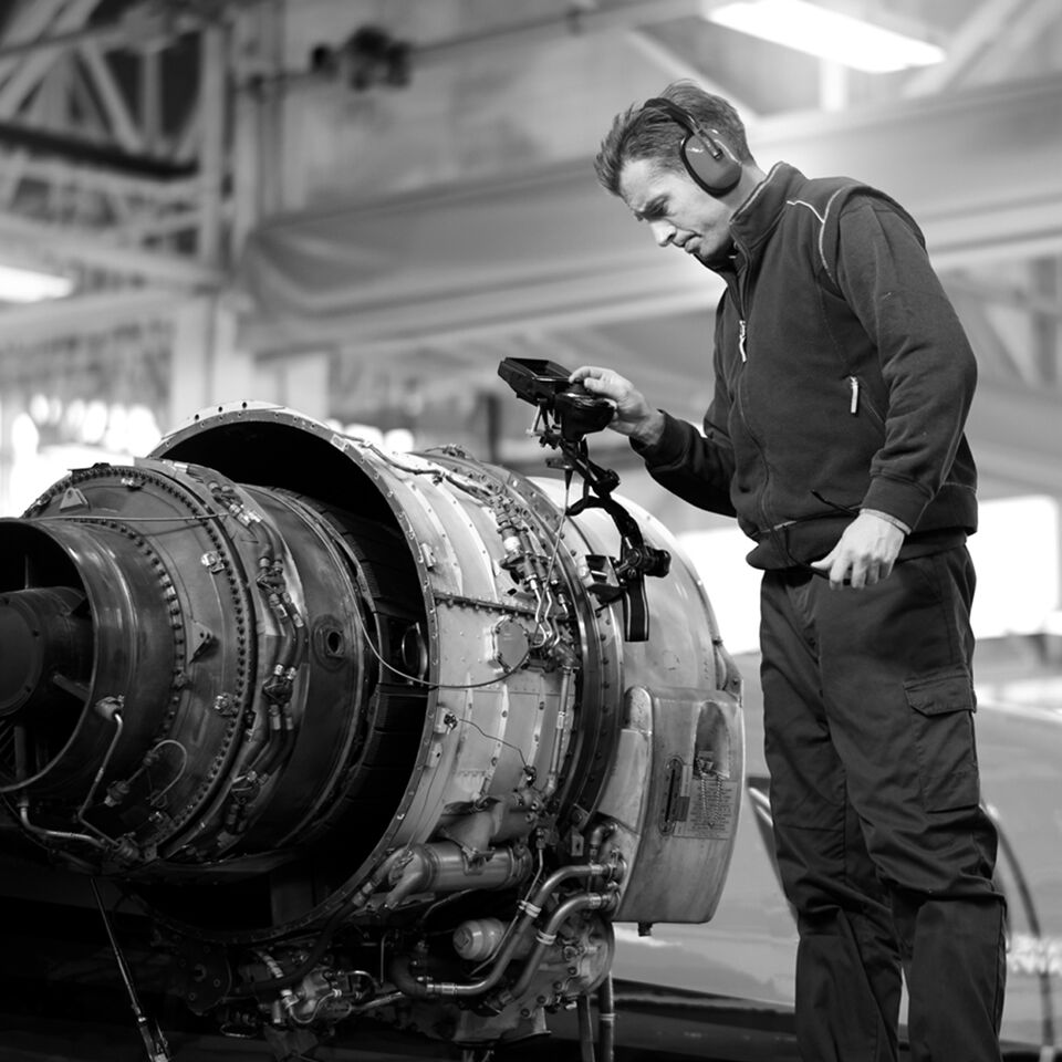 SINGLE-IMAGE_aerospace-engineer-checking-engine_apr25