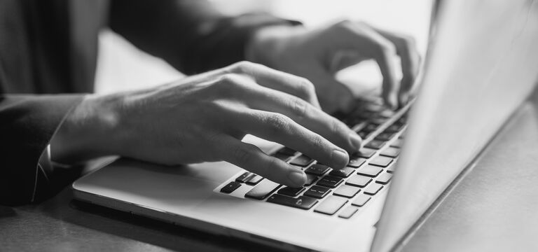 /bynder-asset/bynder:0D771035-50A5-4F67-831B6012AE3433E5/Landscape_MD/SINGLE-IMAGE_close-up-of-a-hands-of-a-businessman-on-a-keyboard_jul25.jpg?1752754029000