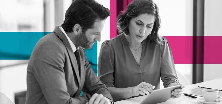 SINGLE-IMAGE_squares-male-and-female-employees-with-digital-tablet_apr25