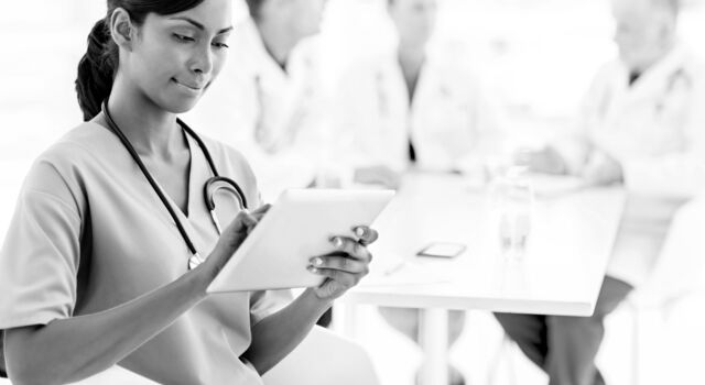 SINGLE-IMAGE_nurse-checking-tablet_aug24
