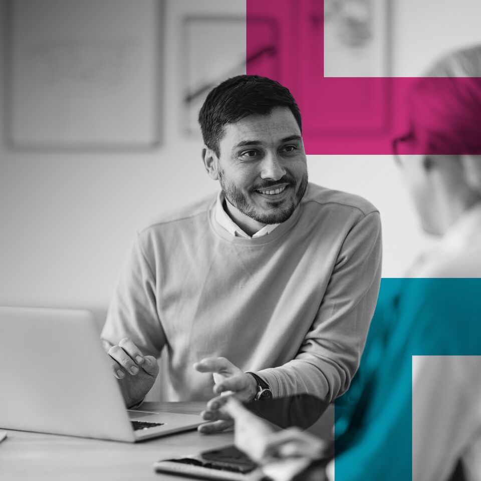 SINGLE-IMAGE_man-talking-to-colleague-with-squares_apr24