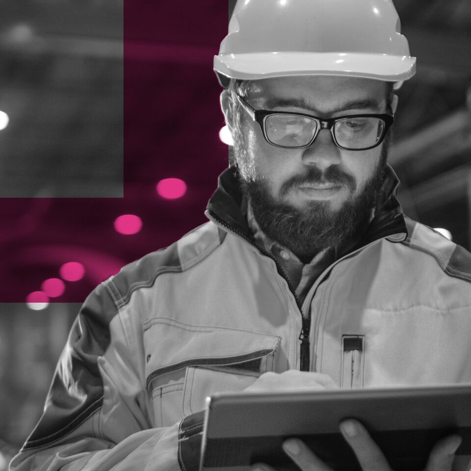 SINGLE-IMAGE_man-with-hard-hat-looking-at-tablet_mar24