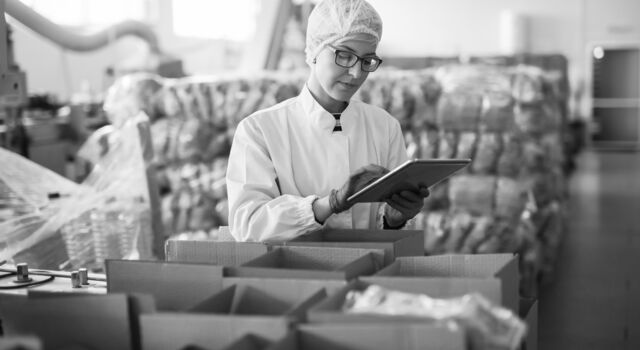 SINGLE-IMAGE_food-industry-woman-checking-stock-tablet_sept23