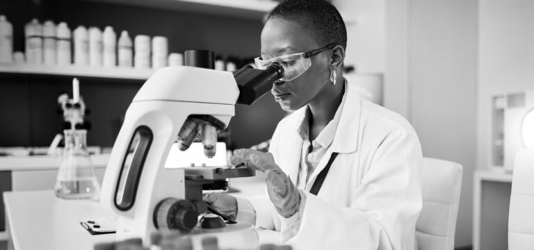 SINGLE-IMAGE_science-laboratory-and-woman-on-microscope-for-blood-test-research_mar25