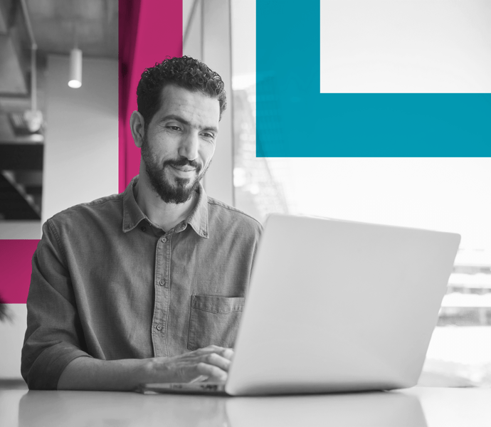 SINGLE-IMAGE_squares-smiling-young-businessman-working-on-a-laptop_may25